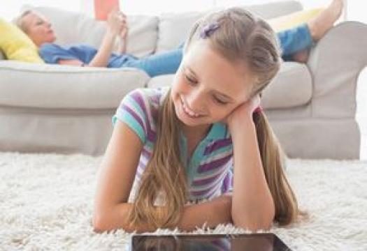 child laying on clean area rug