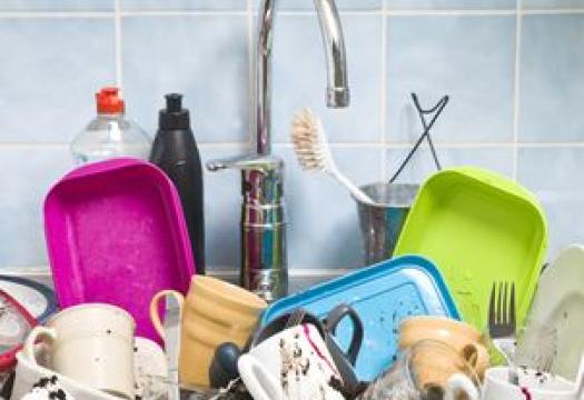 a sink full of filthy dishes