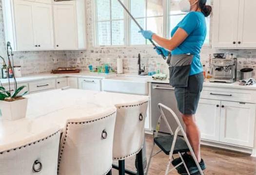Woman cleaning the kitchen